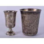 TWO ANTIQUE RUSSIAN SILVER VODKA TOT BEAKERS. 6.75 cm high. (2)