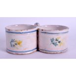 AN EARLY 19TH CENTURY FRENCH FAIENCE DOUBLE SALT painted with flowers. 9 cm wide.