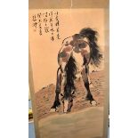A CHINESE WATERCOLOUR SCROLL PAINTING, depicting a horse in a landscape. 134 cm x 67 cm.