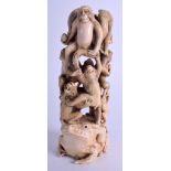 A 19TH CENTURY JAPANESE MEIJI PERIOD CARVED IVORY OKIMONO modelled with numerous monkeys clambering