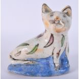 AN UNUSUAL PERSIAN QAJAR POTTERY FIGURE OF A CAT painted with leaves. 14 cm x 15 cm.