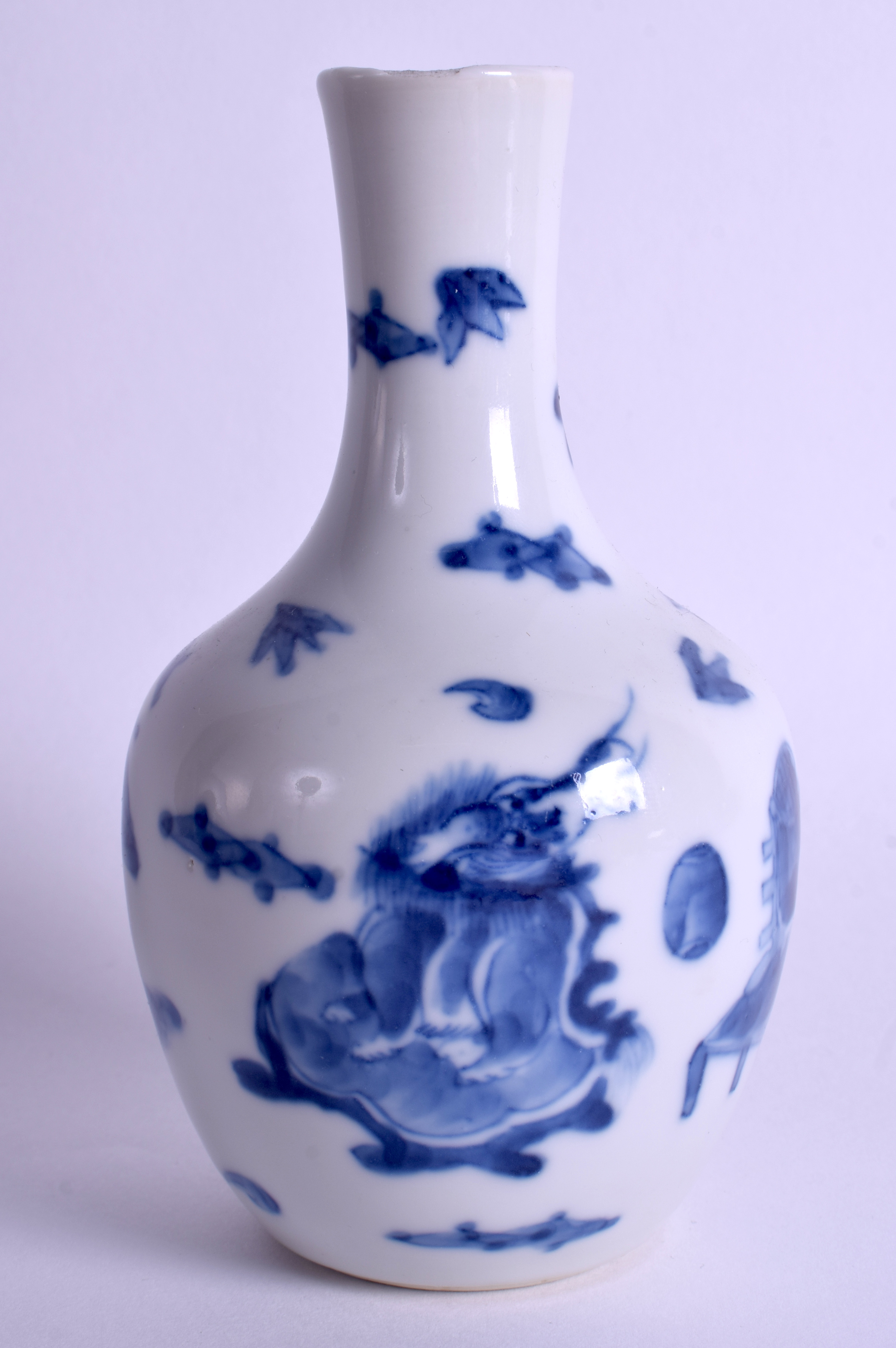 AN 18TH CENTURY JAPANESE EDO PERIOD BLUE AND WHITE VASE painted with Buddhistic lions. 16 cm high.