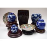 FOUR CHINESE BLUE AND WHITE PORCELAIN GINGER JARS, together with wooden stands, canton dish etc. (q