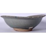 A LARGE 15TH CENTURY CHINESE MING DYNASTY CELADON POTTERY BOWL, incised with foliage. 28.5 cm wide.