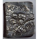 A SILVER COMMON PRAYER BOOK, decorated in relief with winged figures, Birmingham marks. 5.5 cm x 4.