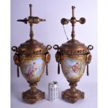 A LARGE PAIR OF 19TH CENTURY SEVRES PORCELAIN TWIN HANDLED VASES converted to lamps, painted with l