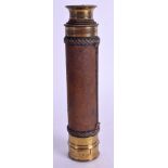 AN ANTIQUE THREE DRAWER BRASS AND LEATHER TELESCOPE. 42 cm long extended.