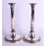 A LARGE PAIR OF 19TH CENTURY CONTINENTAL SILVER CLASSICAL CANDLESTICKS. 26.6 oz. 30 cm high.