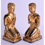 A PAIR OF 19TH CENTURY THAI GILT BRONZE FIGURES OF BUDDHAS modelled praying. 18 cm high.