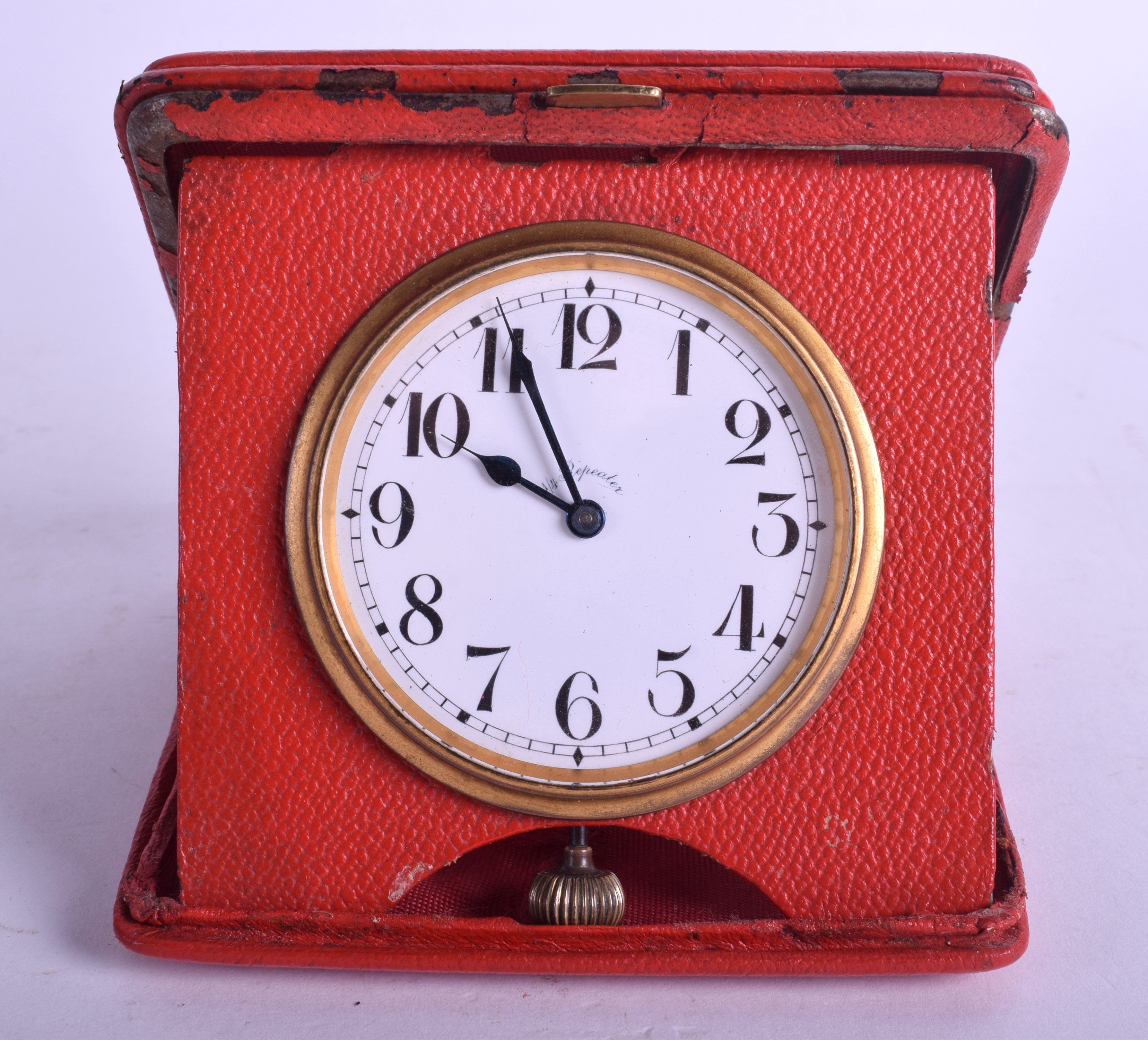 A VERY RARE ART DECO ¼ REPEATER TRAVELLING LEATHER CLOCK with black numerals. 6.5 cm diameter.