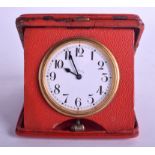 A VERY RARE ART DECO ¼ REPEATER TRAVELLING LEATHER CLOCK with black numerals. 6.5 cm diameter.
