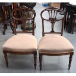 A PAIR OF CHIPPENDALE STYLE CHAIRS, on fluted tapering legs. 87 cm high.