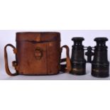 A PAIR OF EARLY 20TH CENTURY FRENCH MILITARY BINOCULARS, with original case. 11.5 cm wide.