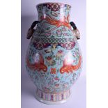 A VERY LARGE 1950S CHINESE PORCELAIN TWIN HANDLED HU VASE with stag handles, painted with phoenix b