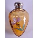 AN ART NOUVEAU CONTINENTAL ENAMELLED AMBER COLOURED TEAR DROP SCENT BOTTLE. 5.5 cm high.