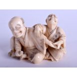 A 19TH CENTURY JAPANESE MEIJI PERIOD CARVED IVORY OKIMONO modelled as a male stretching another's a