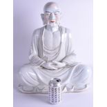 A VERY LARGE 1950S CHINESE PORCELAIN FIGURE OF A BUDDHA modelled with clasped hands and highlighted