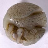 A 20TH CENTURY CHINESE GREEN HARDSTONE CARVING, in the form of a bird feeding its young. 5 cm wide.