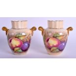 A PAIR OF AYNSLEY FRUIT PAINTED TWIN HANDLED VASES by N Brunt. 8.5 cm high.