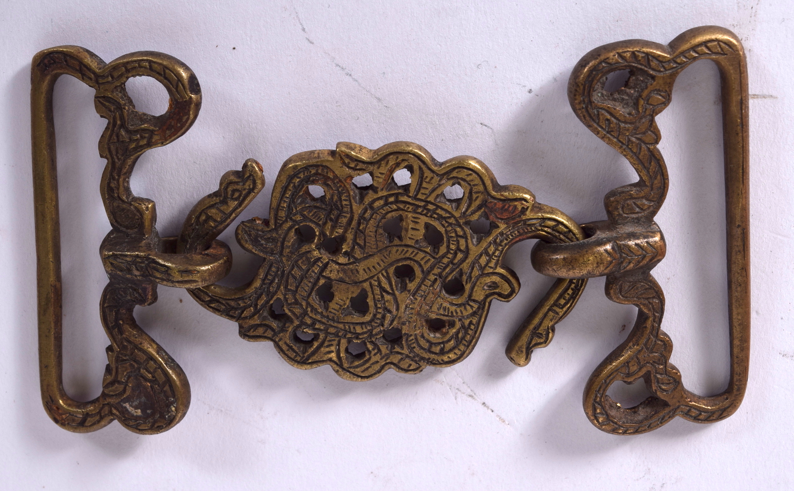 AN ISLAMIC BRONZE BELT BUCKLE, formed as conjoining snakes. 12 cm wide.