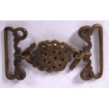 AN ISLAMIC BRONZE BELT BUCKLE, formed as conjoining snakes. 12 cm wide.