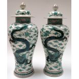 A PAIR OF EARLY 20TH CENTURY SAMSON PORCELAIN VASE AND COVER. painted in the Japanese taste. 40 cm