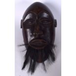 A LARGE EARLY 20TH CENTURY AFRICAN BEARDED HARDWOOD MALE MASK. 44 cm x 24 cm