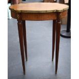 AN EARLY 20TH CENTURY FRENCH WOODEN OCCASIONAL TABLE, formed with reeded tapering legs and metal mo