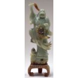 A LARGE CHINESE HARDSTONE JADE STATUE OF BUDDHA, modelled standing with one foot raised. 34 cm high