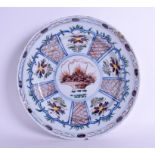 A MID 18TH CENTURY DUTCH DELFT CHARGER C1750 painted with a basket of alternating flowers. 35 cm wi