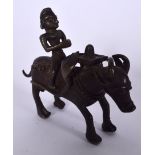 AN INDIAN BRONZE STATUE, formed as a male upon the back of an oxon. 12.5 cm wide.