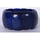 A THICK LAPIS BRACELET, sectional. 6.75 cm wide