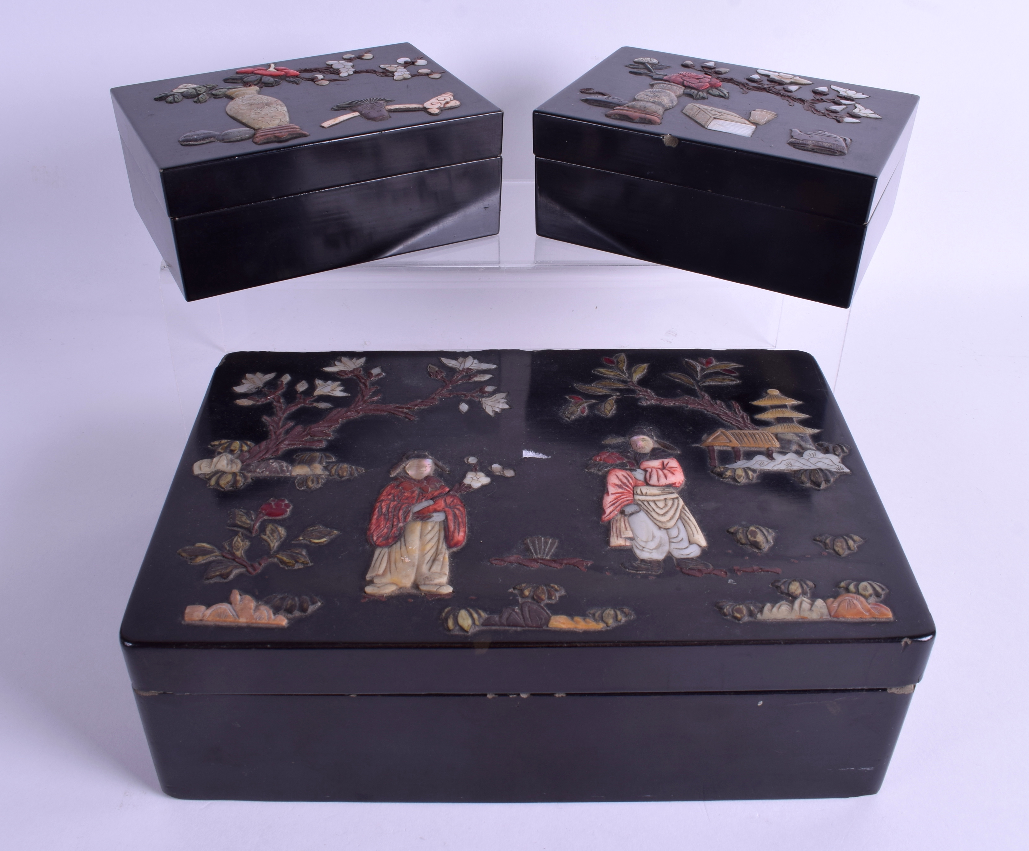 A PAIR OF EARLY 20TH CENTURY CHINESE BLACK LACQUER HARDSTONE BOXES AND COVERS together with a simil
