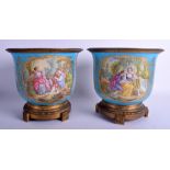 A GOOD LARGE PAIR OF MID 19TH CENTURY FRENCH SEVRES PORCELAIN CACHE POTS painted with lovers and fl