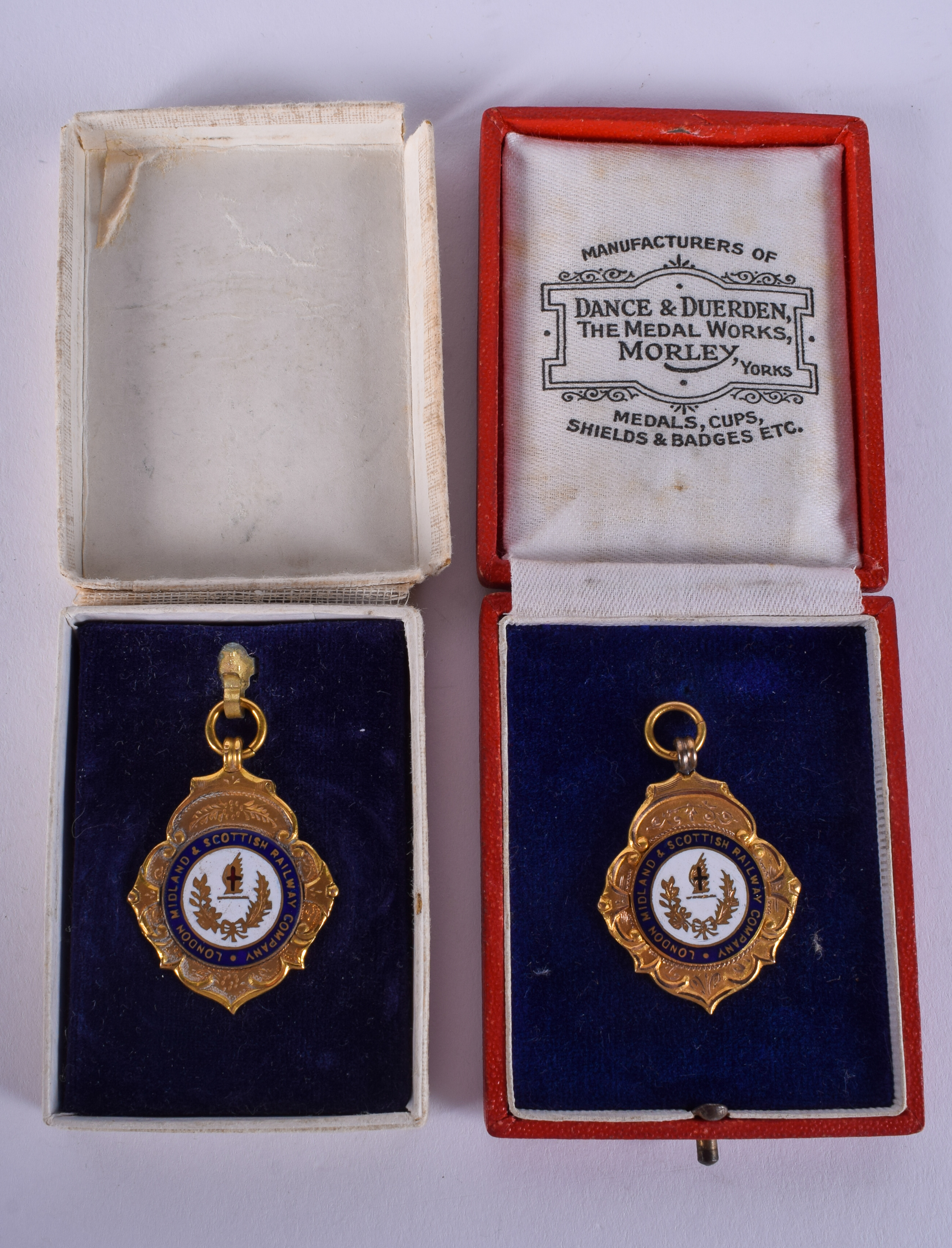 TWO VINTAGE 9CT GOLD AND ENAMEL RAILWAY MEDALLIONS. 15 grams. (2)