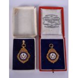 TWO VINTAGE 9CT GOLD AND ENAMEL RAILWAY MEDALLIONS. 15 grams. (2)
