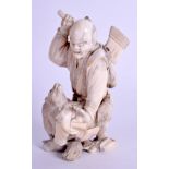 A 19TH CENTURY JAPANESE MEIJI PERIOD CARVED IVORY OKIMONO modelled as a male holding an axe. 11 cm