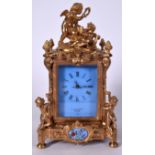 A LARGE ORMOLU AND PORCELAIN INSET MANTEL CLOCK BY VINCENTI ROSE, formed with cherub finial. 31 cm