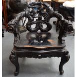 A CHINESE CARVED WOODEN LACQUERED ARM CHAIR, the back splat formed as birds amongst bamboo shoots.