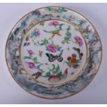 A 19TH CENTURY CHINESE FAMILLE ROSE BUTTERFLY PLATE Qing. 19 cm diameter.