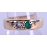 A 9CT GOLD DIAMOND AND EMERALD RING. 5.3 grams. Size P.