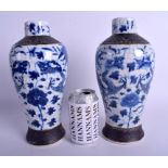 A PAIR OF 19TH CENTURY CHINESE BLUE AND WHITE VASES Qing, painted with dragons. 28 cm high.