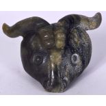 A LARGE CARVED EASTERN HARDSTONE PENDANT, in the form of an oxon head. 10 cm wide.