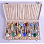 A LOVELY SET OF ART DECO SILVER GILT AND ENAMEL SPOONS by A Tillander. 12 oz. 13.5 cm long. (12)