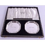 A CASED PAIR OF SILVER DISHES. Birmingham 1950. 1.5 oz. 7.25 cm wide.