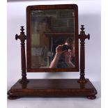 A MAHOGANY DRESSING TABLE MIRROR, formed with turned supports. 59 cm x 51 cm.