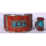 A TIBETAN CORAL AND TURQUOISE INSET WHITE METAL BANGLE, together with a matching ring. Bangle 7.5 c