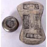 TWO CHINESE WHITE METAL INGOT, of varying design. Largest 6.5 cm wide. (2)