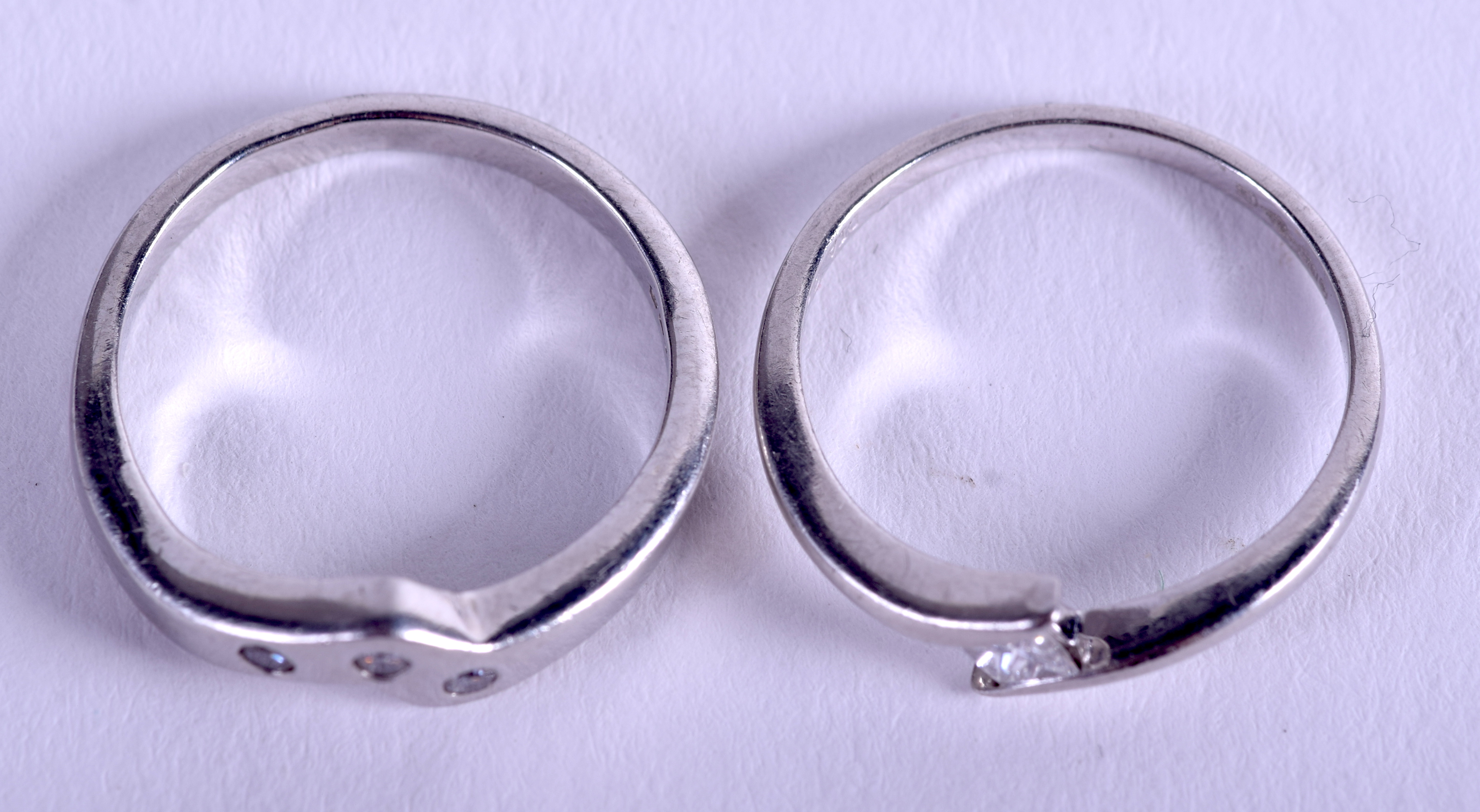 TWO PLATINUM AND DIAMOND WISHBONE RINGS. 6.6 grams. Size J/K. (2) - Image 2 of 4