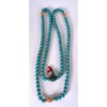 A CHINESE TURQUOISE NECKLACE, formed with carved beads and three bone spacers. 106 cm long.